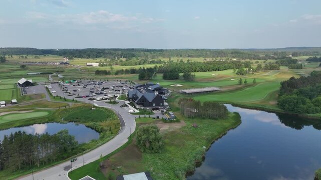 Aerial drone of TPC Toronto at Osprey Valley in Alton, Caledon, Ontario. Scenic golf course with green fairways surrounded by forest and open countryside, highlighting outdoor recreation and leisure.