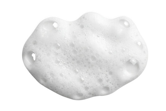 White shaving foam blob with micro bubbles and wet lather texture, top view, isolated on white background