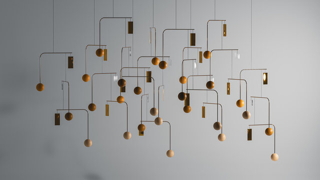 Decorative mobile hangs from the ceiling in modern interior space