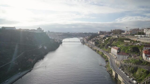 High angle aerial perspective of the Douro river winding through Porto.