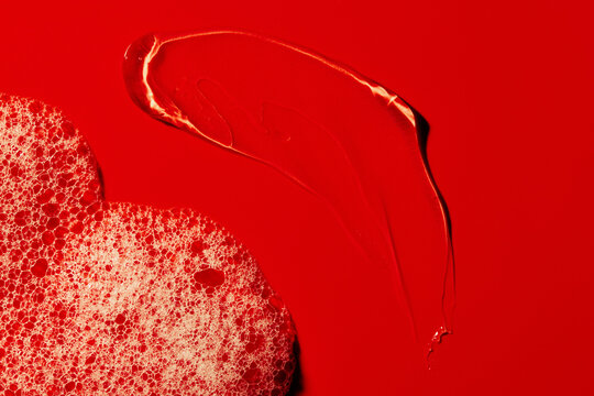 Red Paint With Bubbles on Surface During Creative Art Project