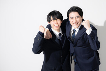 受験を先生や講師と一緒に合格頑張るぞ～の個別指導などのイメージ　カメラ目線ガッツポーズ　コピースペースあり