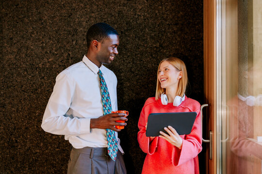 Office colleagues having a discussion during a break