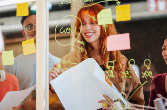 Creative team brainstorming with colored sticky notes