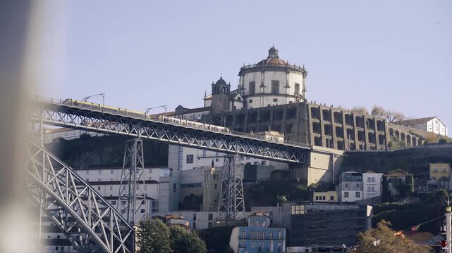 Side profile of the upper bridge deck with the monastery in the background.