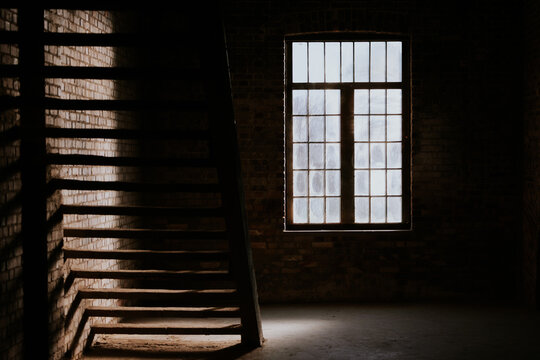 Sunlight streaming through an industrial window