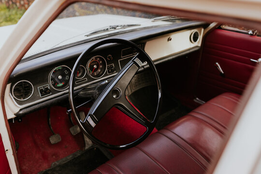 Classic car interior with vintage steering wheel