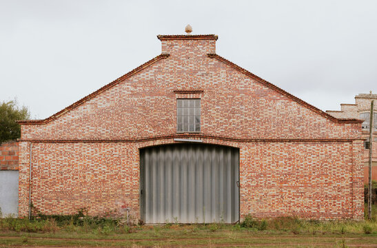 Rustic brick warehouse with metal door facade