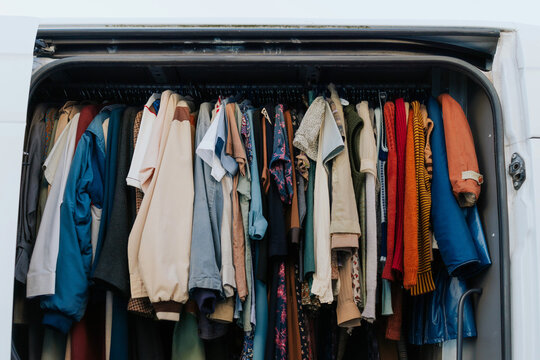 Assortment of vintage clothing hanging in a van