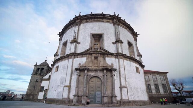 Low angle architectural shot of a historic white stone building facade.