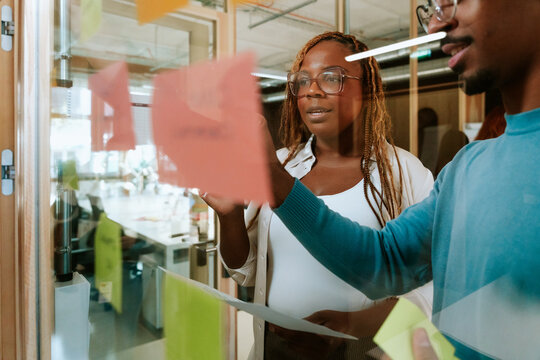 Brainstorming session in modern office with sticky notes