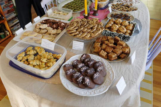 Elaborate spread of Christmas cookies on a large table for exchange