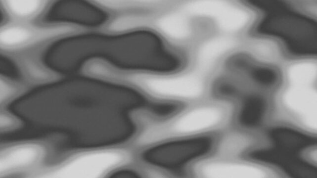 Abstract monochrome texture with blurred shapes creating a dynamic flowing pattern