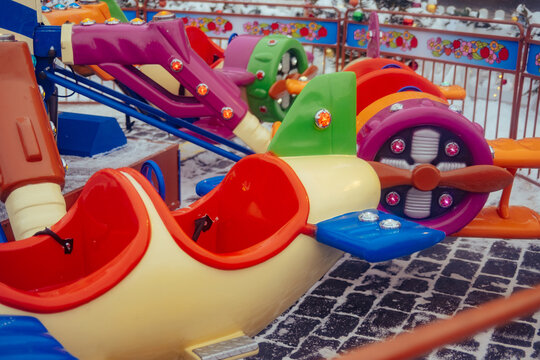 Colorful ride equipment in a winter amusement park