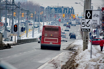 Naklejka premium Toronto public transport TTC 34 Eglinton East Bus on Eglinton Avenue. Toronto, Ontario, Canada, February 6, 2026: Toronto public transport TTC 34 Eglinton East Bus makes its way along Eglinton Avenue 