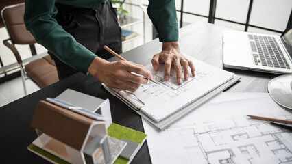 Architecture Man drawing on architectural Creative project business architecture building construction&nbsp;Industrial engineering Achievement Planning Design on eco blueprint