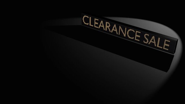 Clearance Sale Sign Illuminated in Spotlight on Dark Background