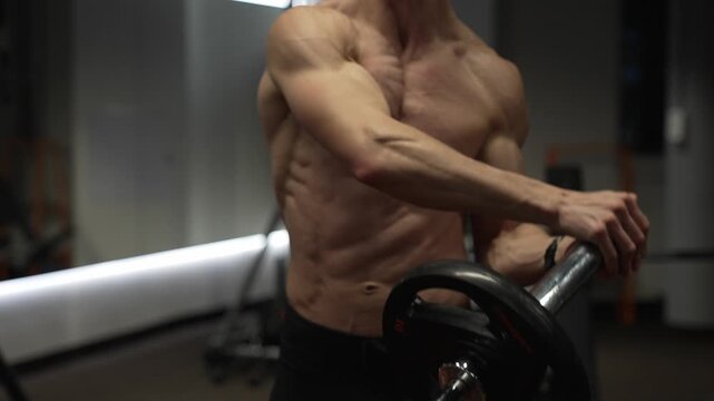 Barbell landmine. Fitness and bodybuilding. Landmine shoulder to shoulder press. Shoulder exercise. Workout training. Athletic man performing landmine exercises with barbell. Strength and fitness