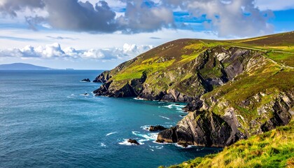 Coastal cliffs meet the ocean under a cloudy sky