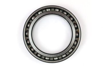 Naklejka premium Professional steel ball bearing isolated on white background, mechanical metal part for industrial machinery and automotive replacement.