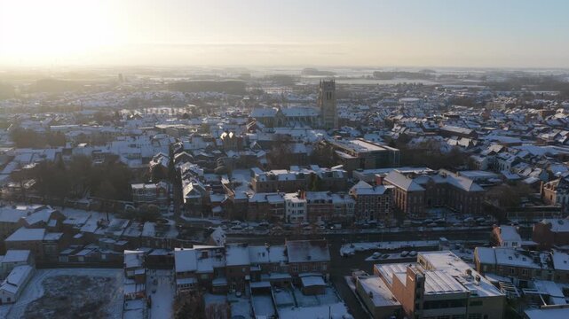 Tongeren Cityscape on a Sunny Winter Day with Snow on the Roofs AERIAL