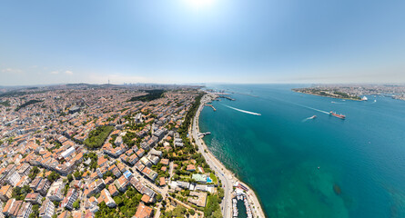 Fototapeta premium Istanbul, Turkey. Wide aerial view of Bosphorus and Marmara Sea featuring Haydarpasa Port, maritime traffic and districts of Fatih and Uskudar. Aerial view.
