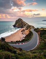 Dramatic coastal landscape with a winding road, beach, and cliffs