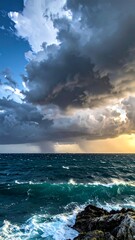 Dramatic seascape with stormy sky and crashing waves over rocks