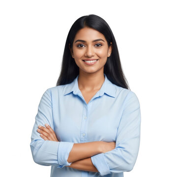 A confident woman in a light blue shirt standing with her arms crossed