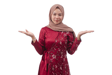 Young woman in red dress and hijab presenting or questioning with open hands