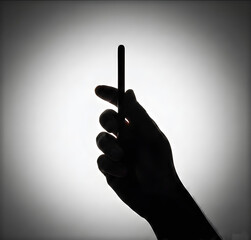 Side Silhouette Shadow of Hand Holding Slim Smartphone