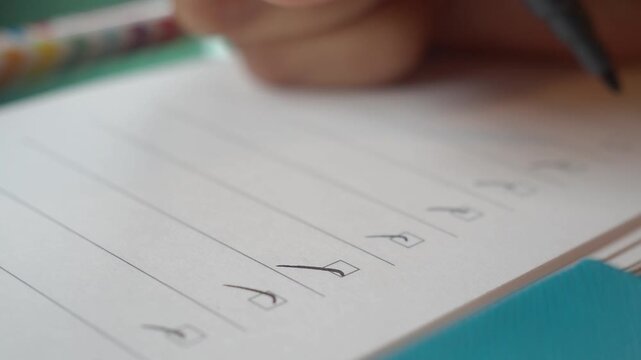 Writing a checklist on paper with a marker