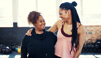 People, friends and smile for fitness at gym with discussion, training advice and funny feedback. Women, laugh and conversation with embrace, exercise break and bonding together for recovery wellness