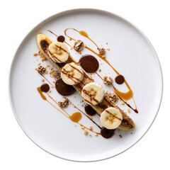 Elegant dessert grilled banana topped with slices, chocolate, caramel, and crumbs