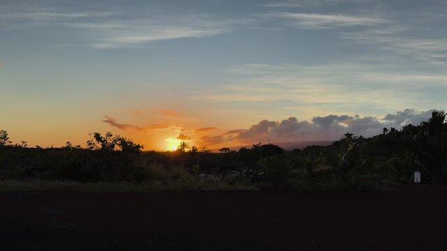 Hawaiian sunset at Uncle Robert's, serene and golden hour vibes