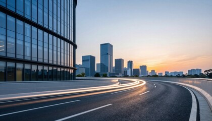 Fototapeta premium Urban Highway Curving Around Glass Office Buildings at Sunset