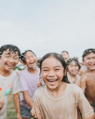 Obraz premium Group of Happy Children Playing Water Fight Outdoors During Summer Festival Celebration in a Garden Setting Featuring Laughing Kids and Large Copy Space for Advertising