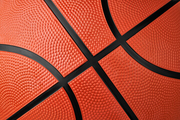 Fototapeta premium Macro shot rubber orange basketball ball with texture and black seams