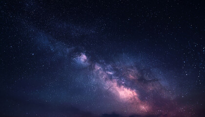 Fototapeta premium Starry night sky with the milky way galaxy displaying vibrant shades of pink, purple, and blue across a dark celestial canvas