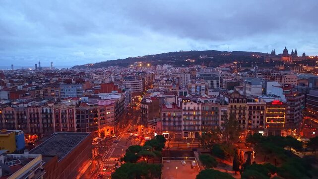 La Nova Esquerra de l'Eixample neighborhood in Barcelona at dusk, Spain. Aerial forward, copy space