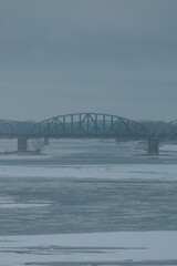 Obraz premium View of the bridges of the city of Toruń and the frozen Vistula River