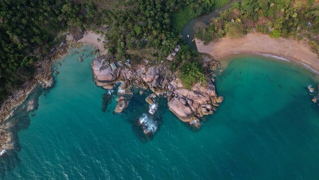 drone picture of Than Sadet beach on Koh Phangan island paradise with colourful rocks and tranquil seas. Drone, top view,daytime