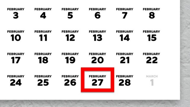 The date February 27th marked with a red cursor on the wall calendar 2026