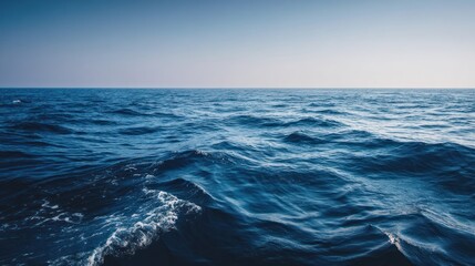 A deep blue ocean under a clear sky, vintage nautical aesthetic