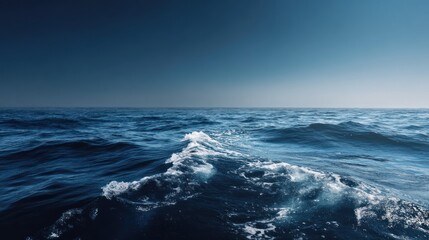 A deep blue ocean under a clear sky, vintage nautical aesthetic