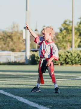 boy celebrating a win in flag football