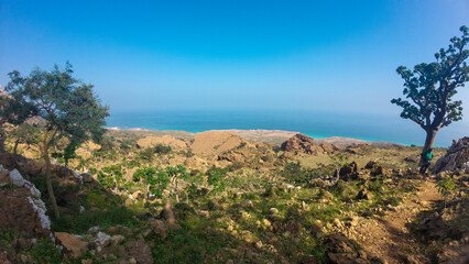 Rugged coastal mountains overlooking the blue sea