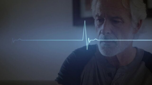 Senior man watching laptop while ECG waveform sweeping across scene, initiating heart monitoring