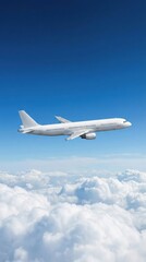 Obraz premium Commercial Airplane Soaring Above Fluffy Clouds Against a Clear Blue Sky on a Bright Sunny Day.