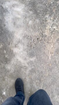 The road was covered with ice after the rain in the frost.